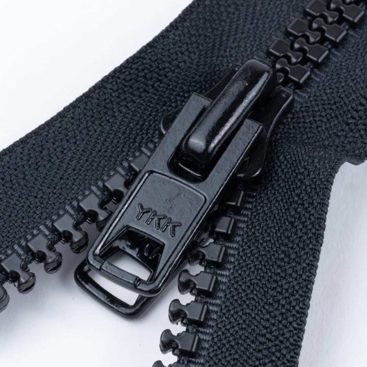 Black YKK double-pull zipper used on custom Sunshade panels and storage bags