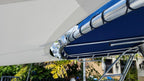 Close-up of navy lacing on a stainless steel sun shade pole