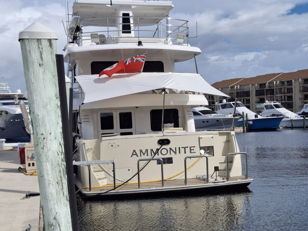 Custom Sunshade rigged over the aft deck of the motor yacht Ammonite at the dock