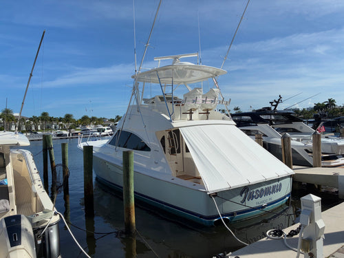 Custom white Sunshade shading the cockpit of a Viking sport fisher at the dock in Fajardo, Puerto Rico